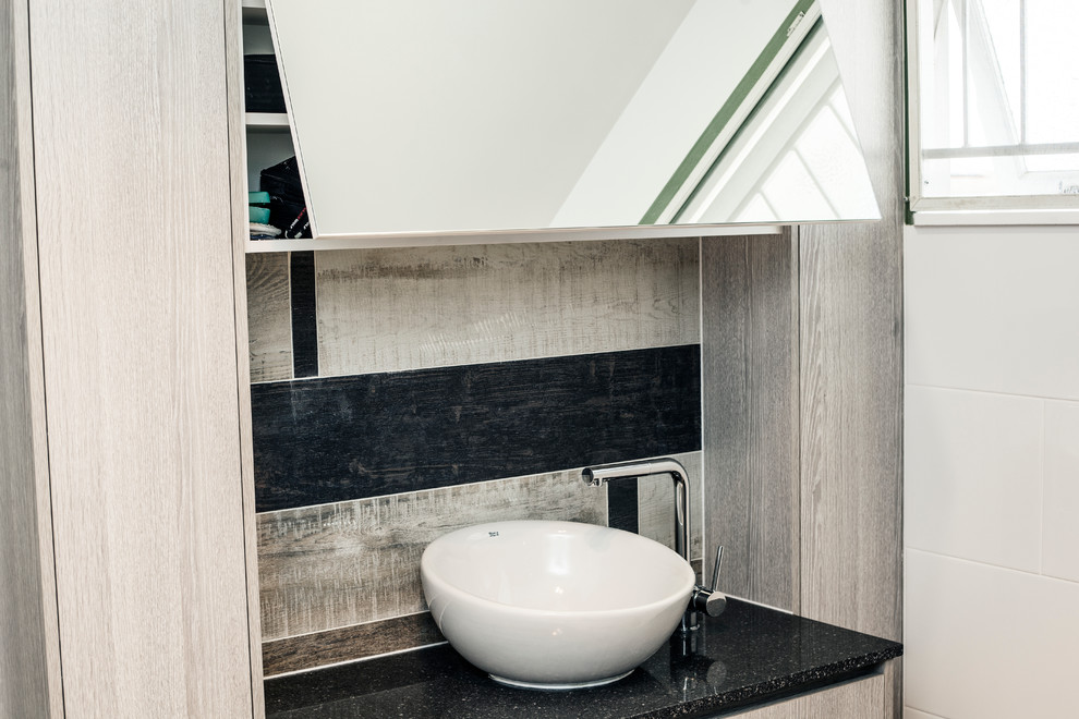 Inspiration for a mid-sized contemporary bathroom in Brisbane with flat-panel cabinets, light wood cabinets, a corner shower, white tile, porcelain tile, white walls, a vessel sink and an open shower.