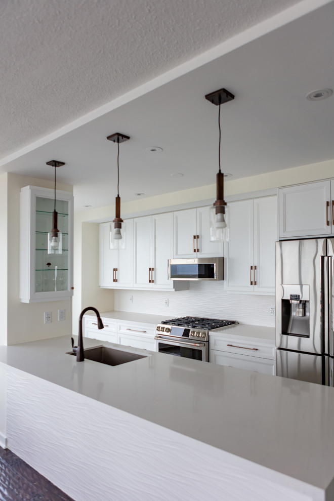 Example of a transitional kitchen design in Toronto