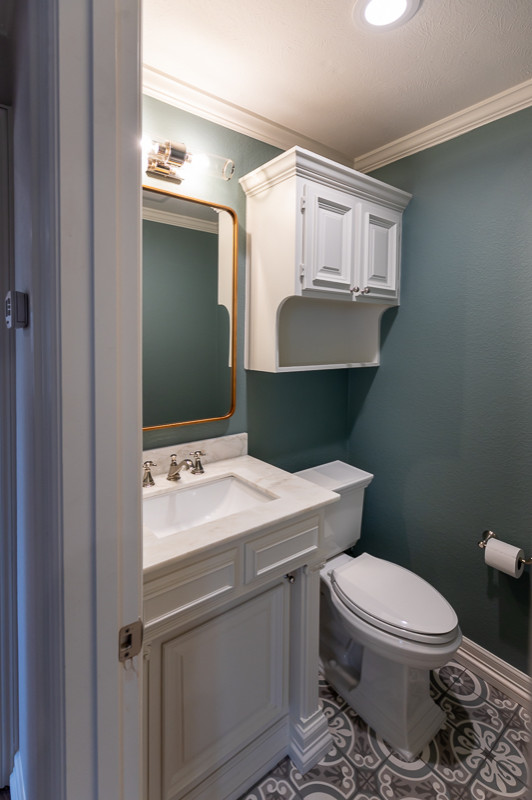 Example of a small classic green tile and porcelain tile marble floor and gray floor powder room design in Dallas with raised-panel cabinets, white cabinets, a two-piece toilet, white walls, an undermount sink, marble countertops, white countertops and a built-in vanity