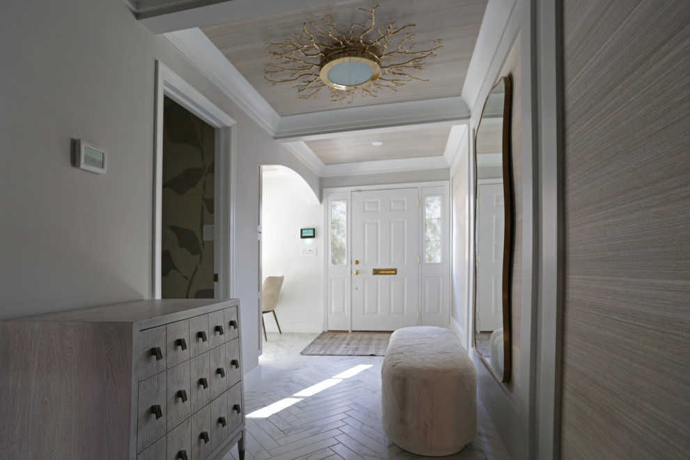 Example of a mid-sized transitional l-shaped marble floor, white floor and exposed beam kitchen design in DC Metro with an undermount sink, shaker cabinets, white cabinets, quartzite countertops, white backsplash, quartz backsplash and stainless steel appliances