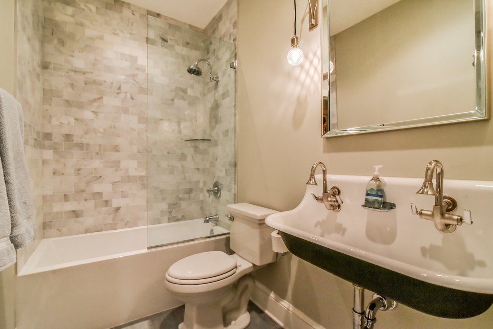 Inspiration for a mid-sized transitional 3/4 bathroom in Other with beige tile, beige walls, an open shower, an alcove tub, a shower/bathtub combo, a two-piece toilet, stone tile and a trough sink.