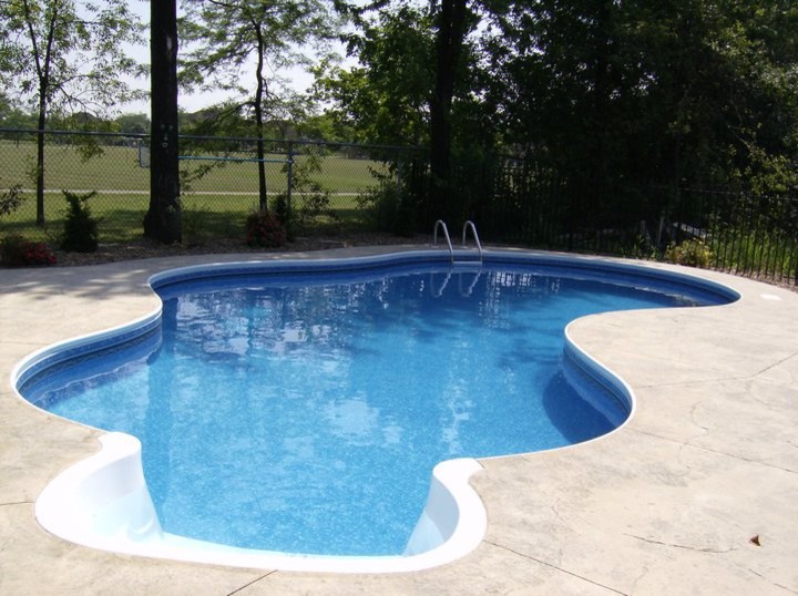 Large backyard stone pool photo in Toronto