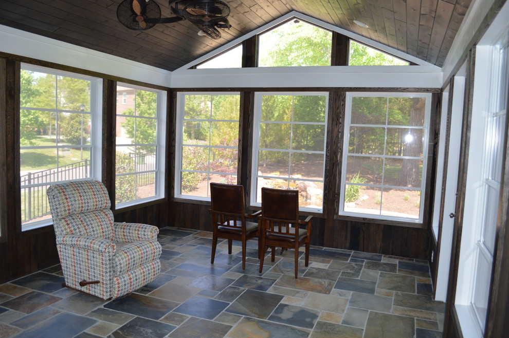 This is an example of a transitional sunroom in Charlotte.