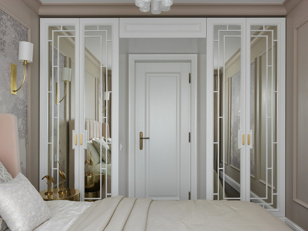 This is an example of a transitional master bedroom in Moscow with beige walls.