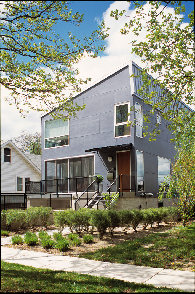 Photo of a contemporary two-storey grey exterior in Detroit.