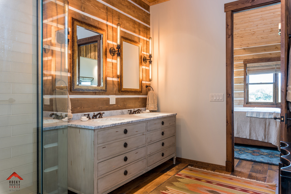 Corner shower - small rustic 3/4 medium tone wood floor and brown floor corner shower idea with distressed cabinets, a trough sink, wood countertops and a hinged shower door