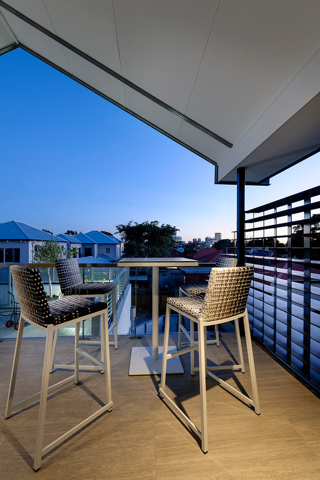 This is an example of a contemporary deck in Perth with a roof extension.