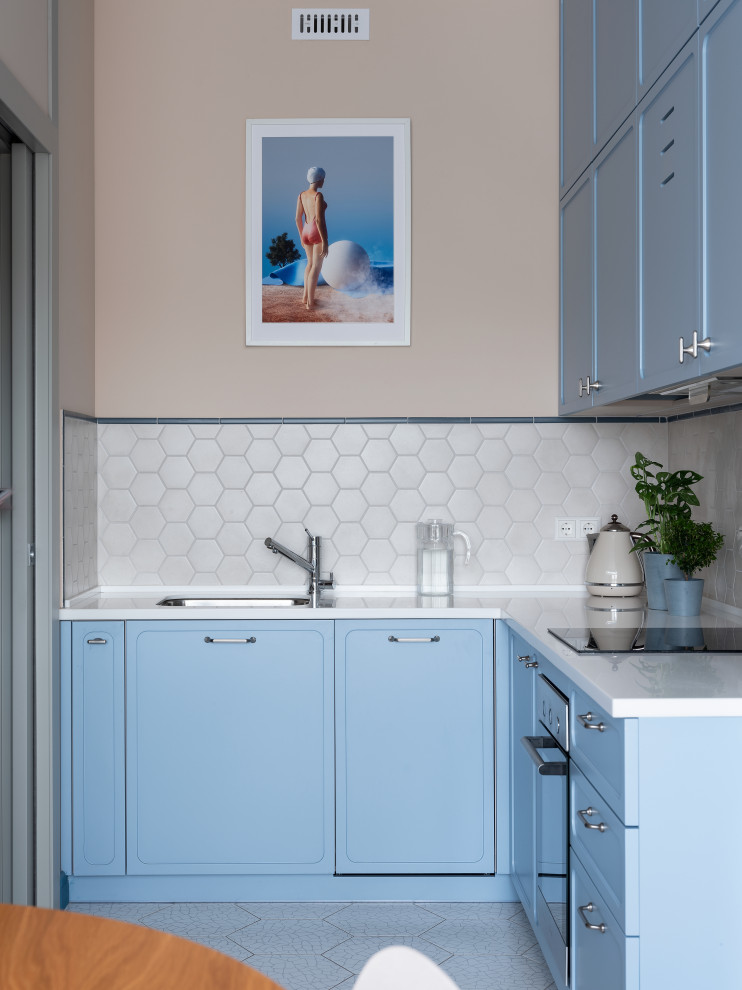 Eat-in kitchen - contemporary eat-in kitchen idea in Moscow with blue cabinets, no island and blue countertops