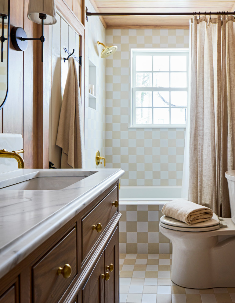Mid-sized transitional multicolored tile and porcelain tile porcelain tile, multicolored floor, double-sink, wood ceiling and wood wall bathroom photo with furniture-like cabinets, dark wood cabinets, an undermount tub, a one-piece toilet, brown walls, an undermount sink, quartzite countertops, white countertops, a niche and a freestanding vanity