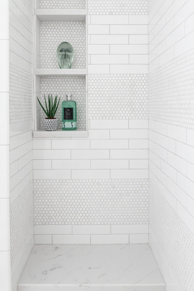 Design ideas for a kids bathroom in New York with an alcove shower, white tile, marble floors, a hinged shower door, white walls, pebble tile and white floor.