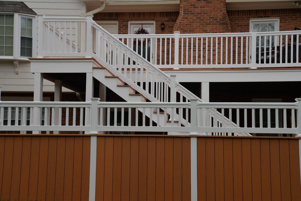 This is an example of a mid-sized arts and crafts backyard deck in Other.