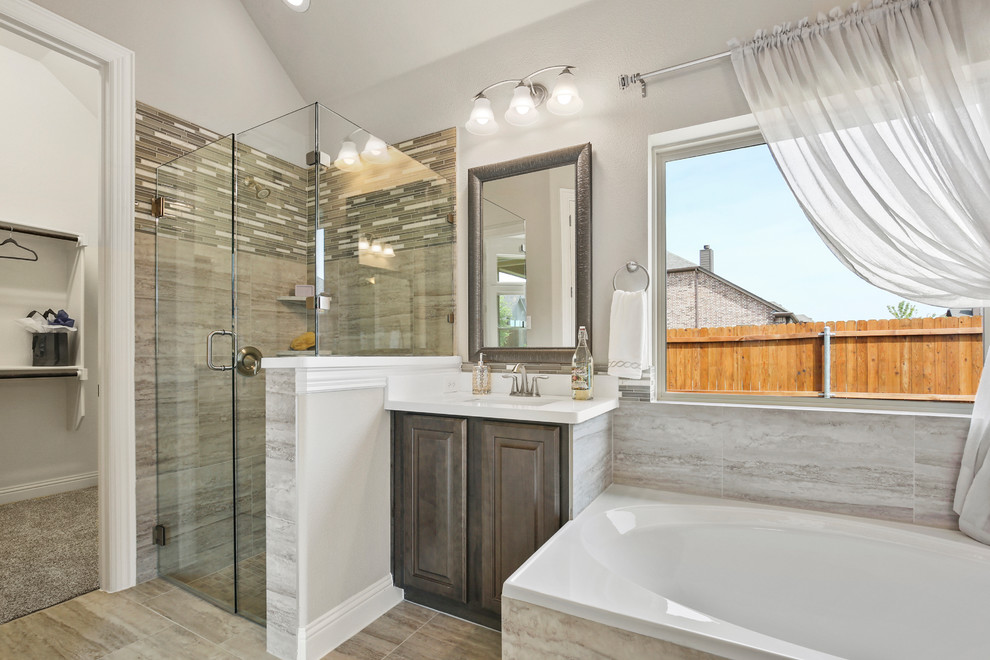 Inspiration for a mid-sized contemporary master bathroom in Dallas with raised-panel cabinets, dark wood cabinets, a corner tub, a corner shower, beige tile, ceramic tile, beige walls, ceramic floors, an undermount sink, solid surface benchtops, beige floor, a hinged shower door and white benchtops.