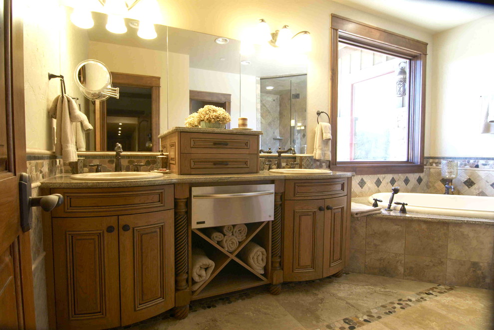 This is an example of a country bathroom in Other with raised-panel cabinets, medium wood cabinets, beige tile, stone tile, marble floors, a drop-in sink, granite benchtops and with a sauna.