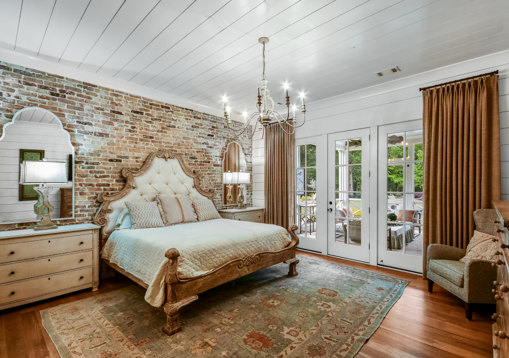 This is an example of a farmhouse bedroom in Atlanta.