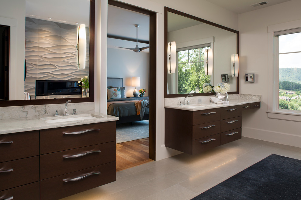 Design ideas for a large contemporary master bathroom in Other with flat-panel cabinets, dark wood cabinets, a freestanding tub, a corner shower, a one-piece toilet, gray tile, stone tile, grey walls, limestone floors, an undermount sink and quartzite benchtops.