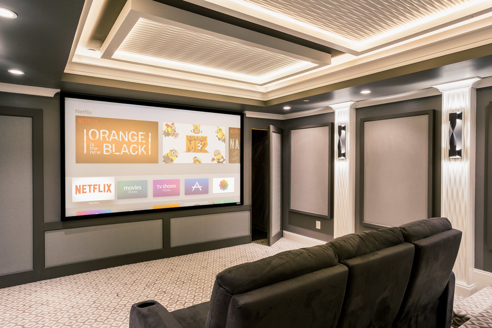 Large contemporary open concept home theatre in DC Metro with brown walls, carpet, a projector screen and multi-coloured floor.
