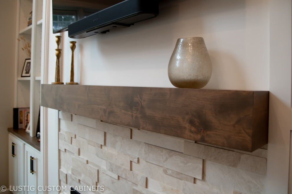 Inspiration for a large transitional l-shaped laminate floor and brown floor open concept kitchen remodel with an undermount sink, flat-panel cabinets, white cabinets, quartz countertops, white backsplash, ceramic backsplash, stainless steel appliances, an island and white countertops