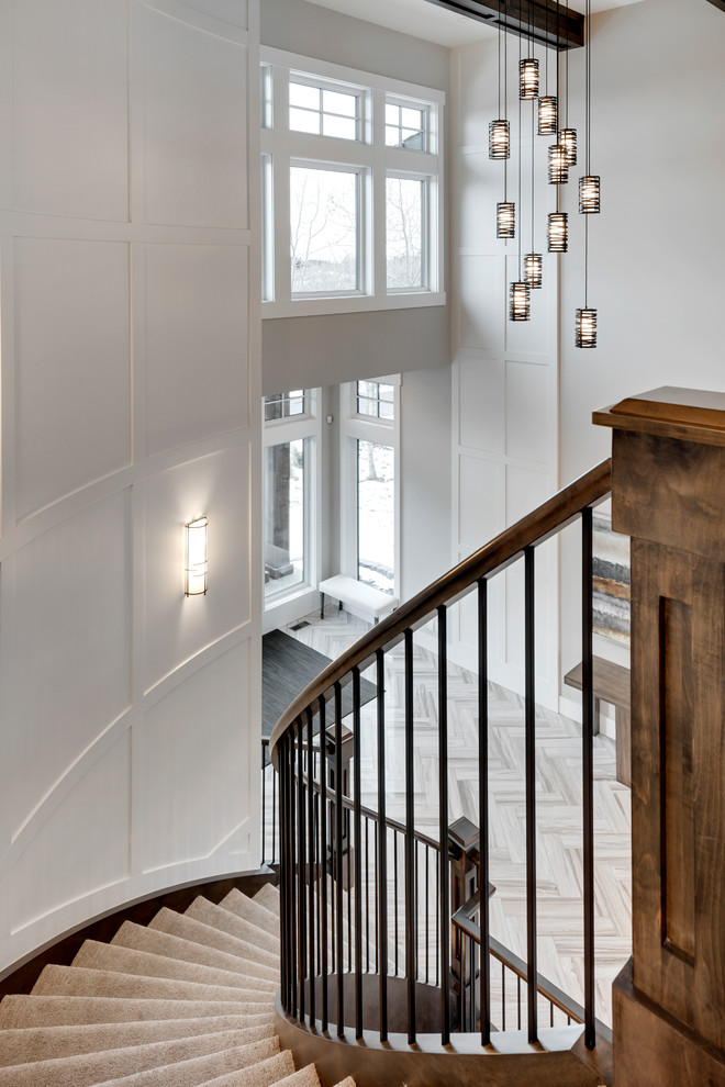 Inspiration for a huge transitional marble floor and gray floor staircase remodel in Calgary with gray walls and a dark wood front door