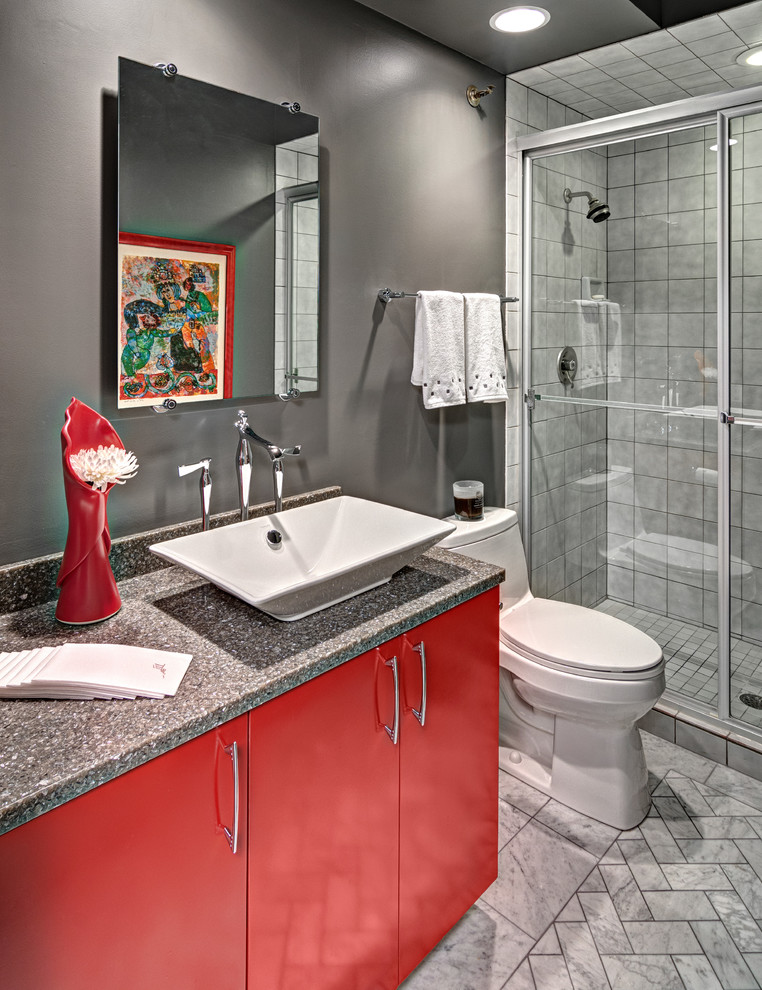This is an example of a small contemporary 3/4 bathroom in Minneapolis with a vessel sink, flat-panel cabinets, red cabinets, engineered quartz benchtops, a double shower, a one-piece toilet, gray tile, stone tile, grey walls and marble floors.