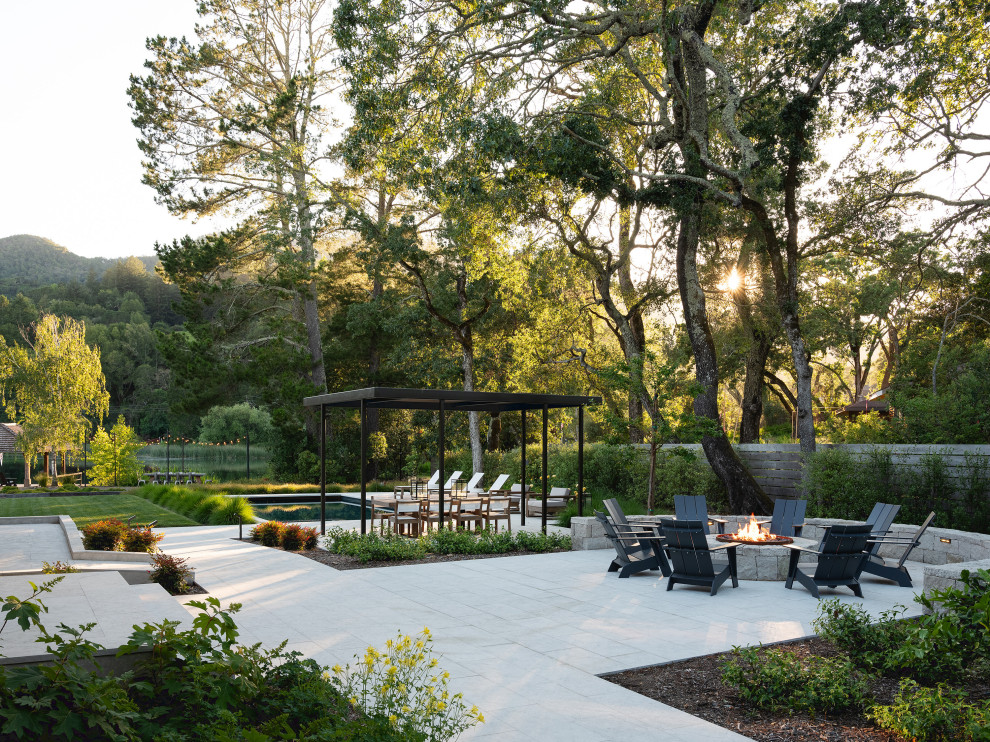 Patio - contemporary patio idea in San Francisco with a fire pit and no cover
