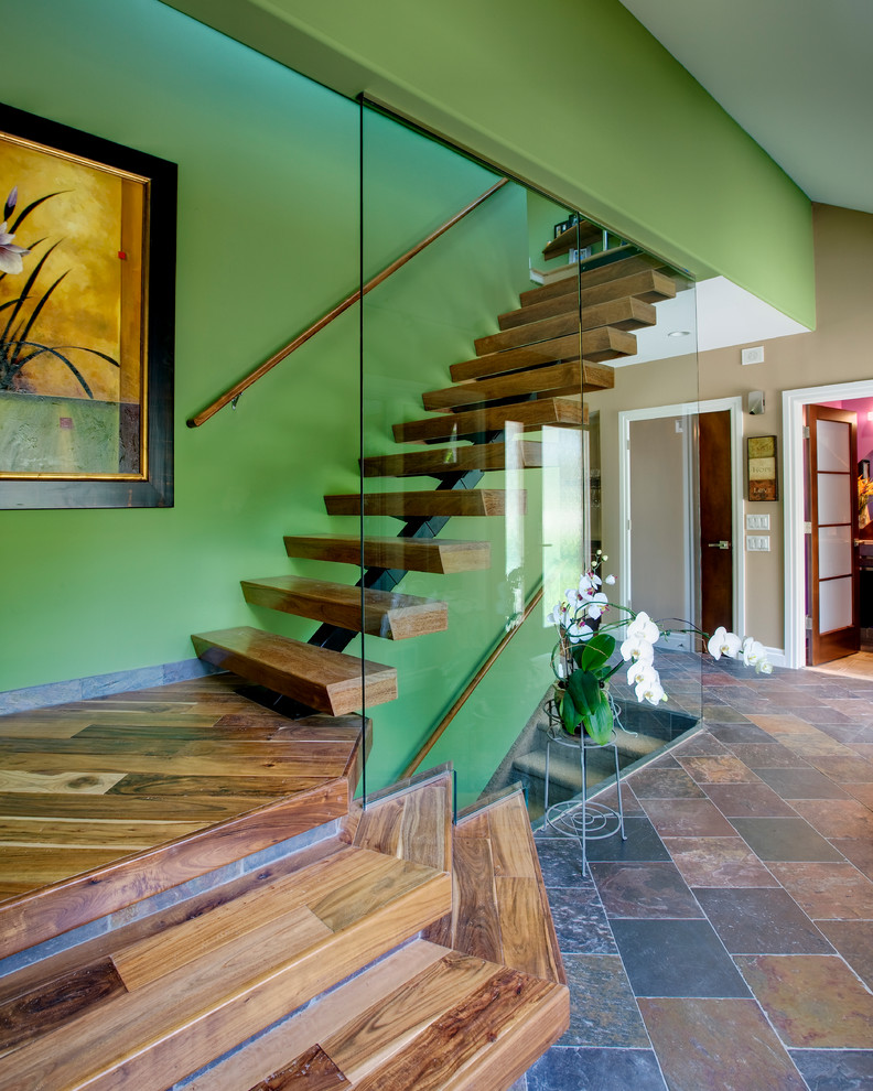 Photo of a large modern wood floating staircase in Philadelphia with open risers.