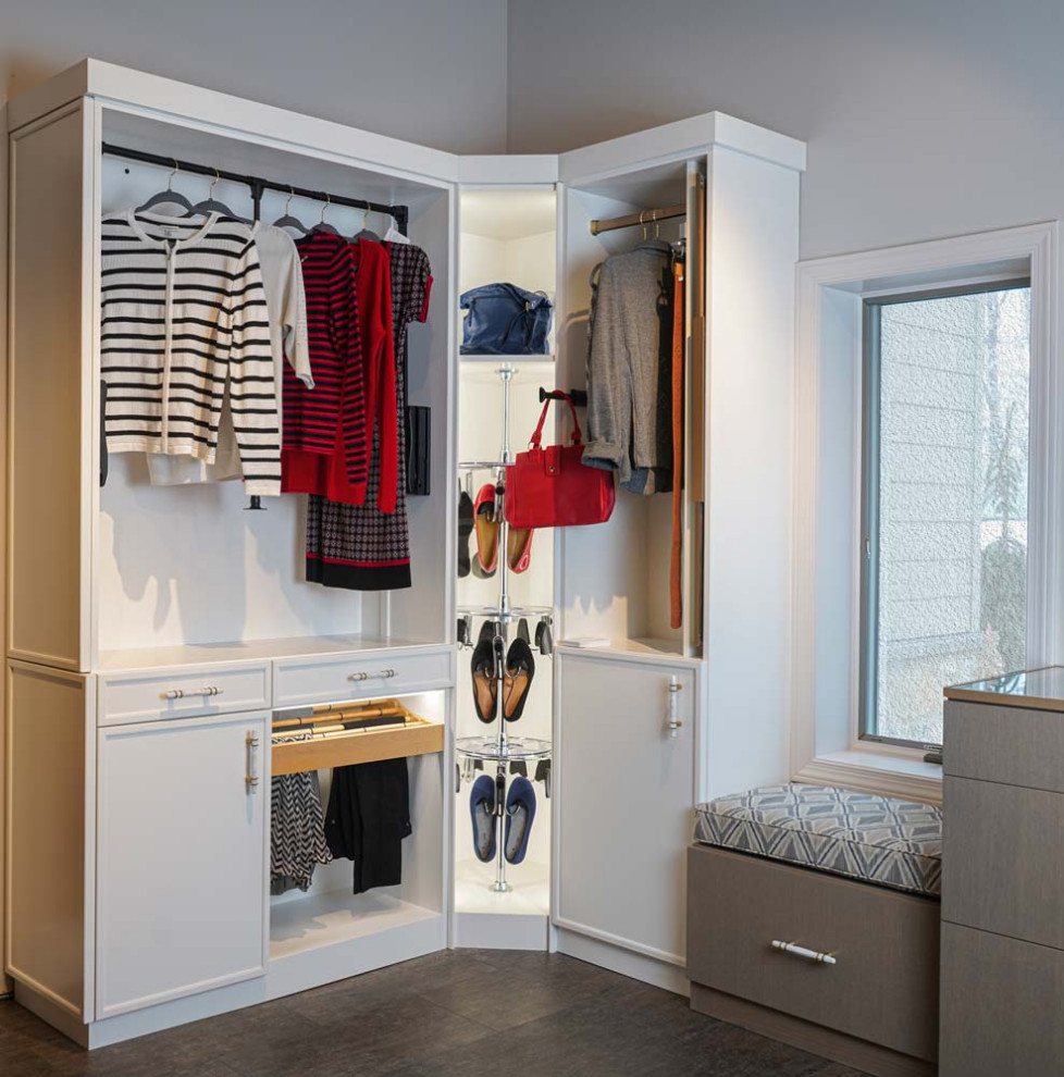 This is an example of a traditional wardrobe in Other with recessed-panel cabinets and white cabinets.