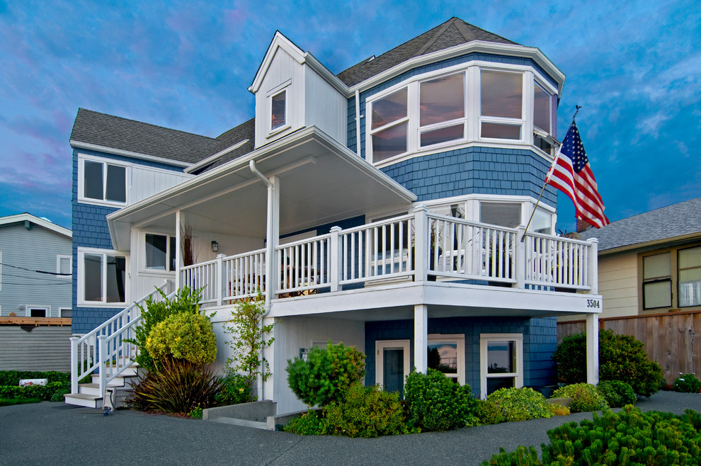 This is an example of a beach style two-storey blue exterior in Seattle.