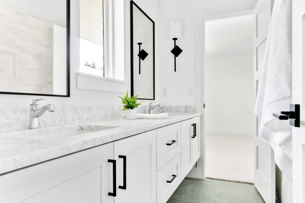 Photo of a large midcentury family bathroom in Dallas with shaker cabinets, white cabinets, an alcove bath, a shower/bath combination, a two-piece toilet, white tiles, white walls, a submerged sink, green floors, a shower curtain, white worktops, double sinks, a floating vanity unit, marble tiles, marble flooring and marble worktops.