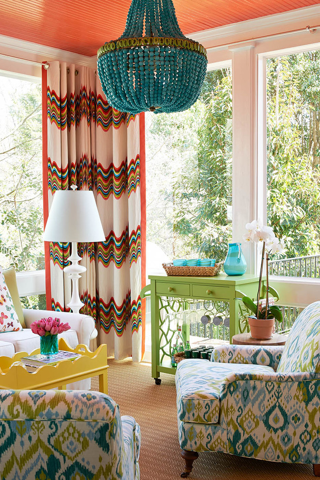 Photo of a traditional sunroom in Charlotte with a standard ceiling and brown floor.