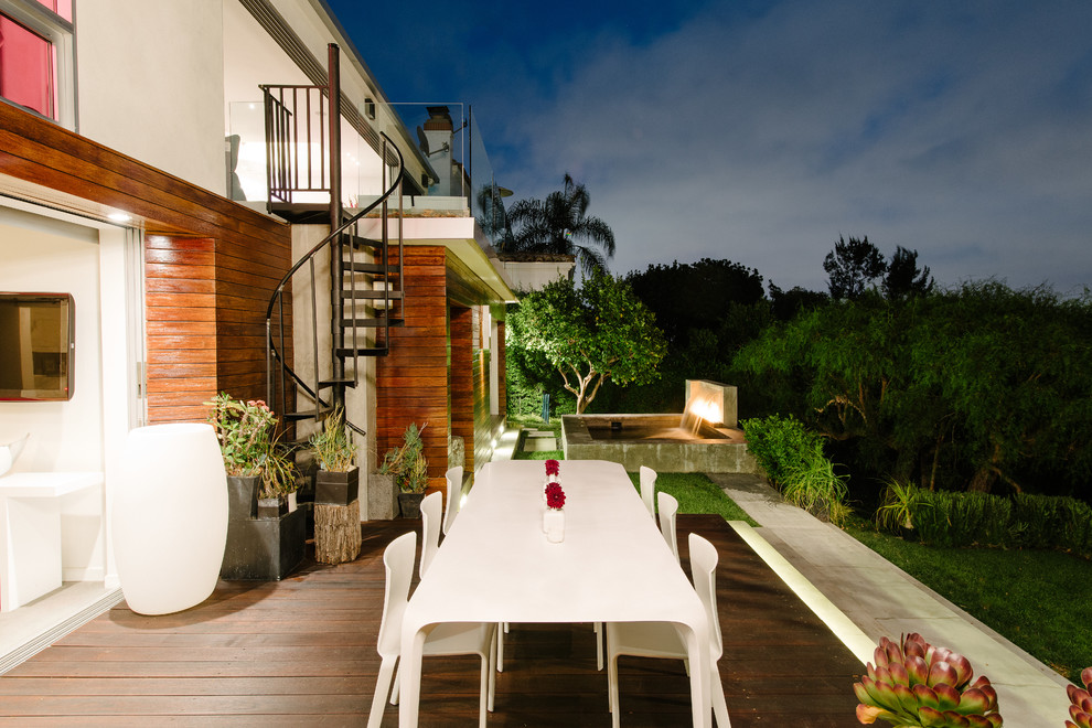 This is an example of a contemporary deck in Los Angeles with a water feature.