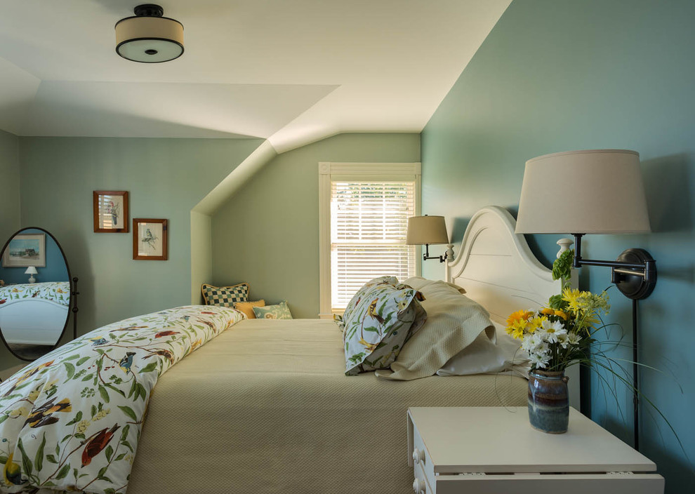 Photo of a beach style bedroom in Portland Maine with blue walls.