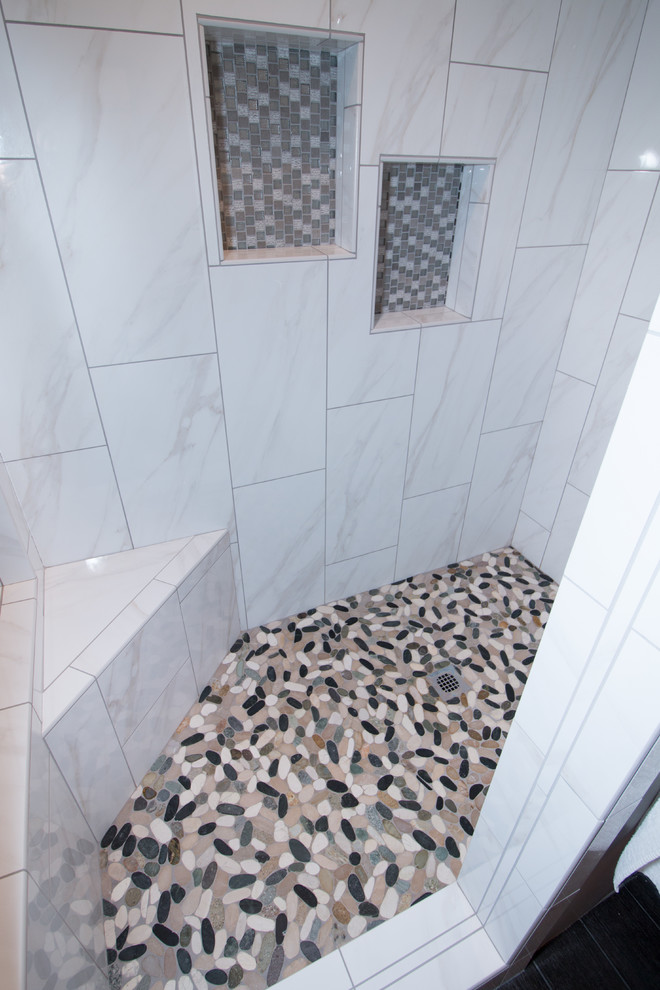 Home design - small transitional master porcelain tile porcelain tile home design idea with recessed-panel cabinets, gray cabinets, a two-piece toilet, gray walls, an undermount sink and quartz countertops