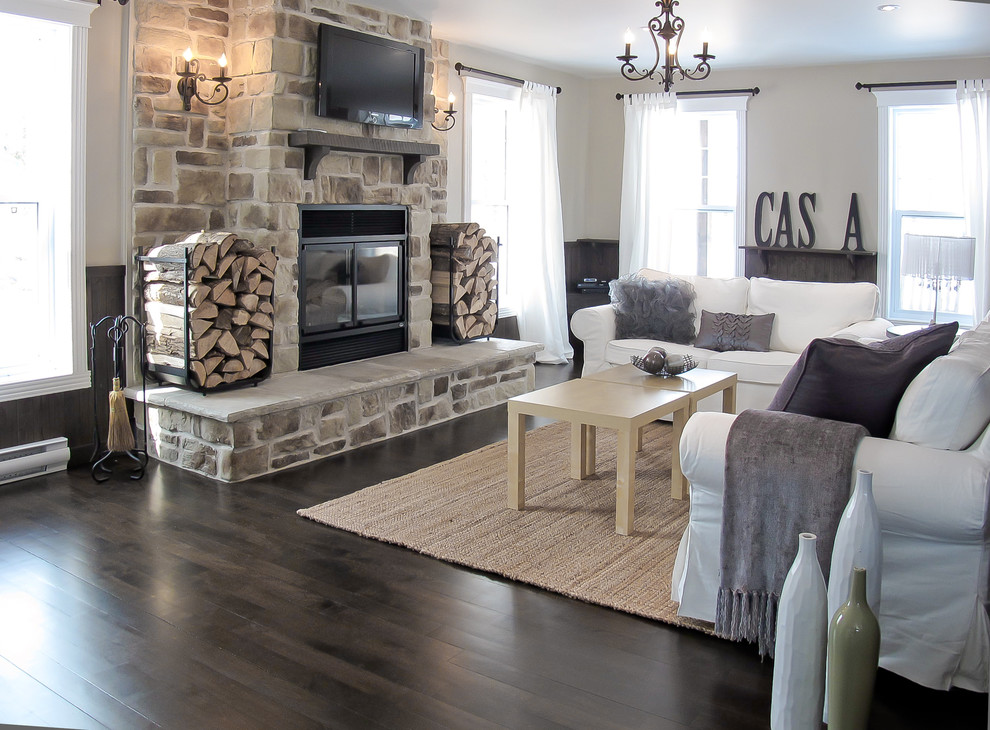 Inspiration for a contemporary living room in Montreal with a standard fireplace, a stone fireplace surround and a wall-mounted tv.