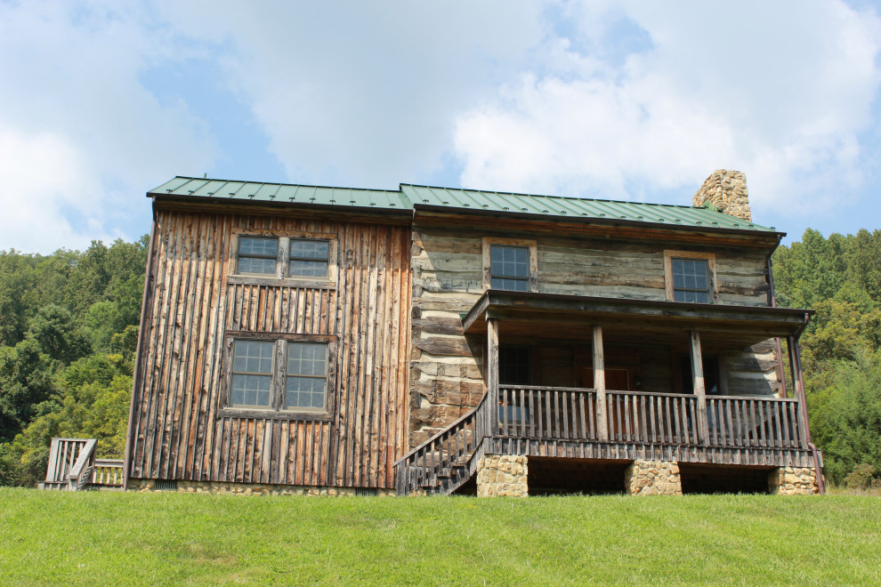 Mid-sized brown two-story wood house exterior idea with a metal roof
