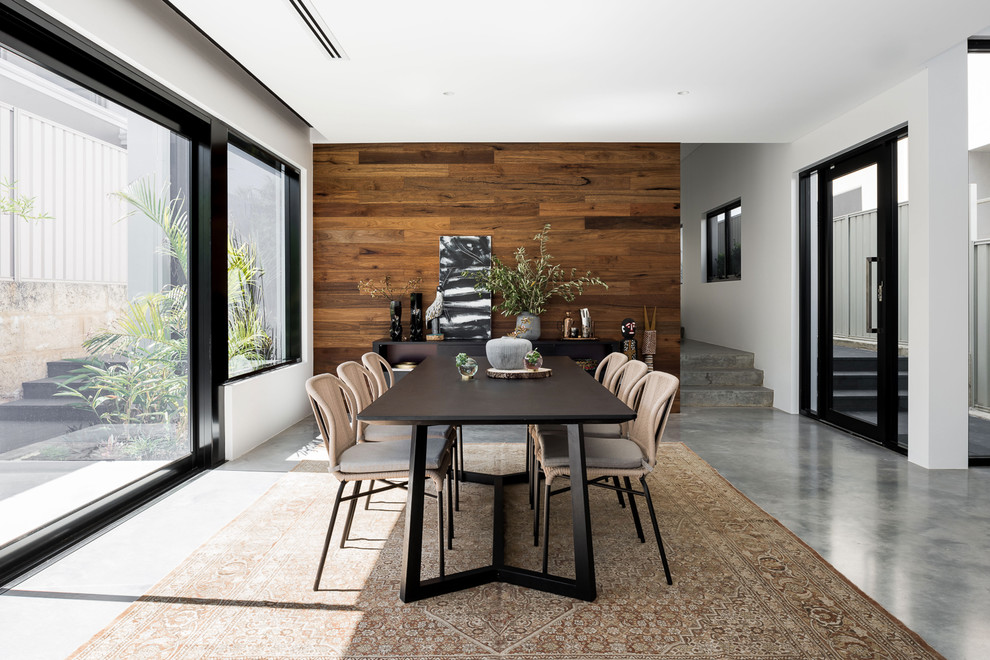 Photo of a large contemporary dining room in Perth with white walls, concrete floors and grey floor.