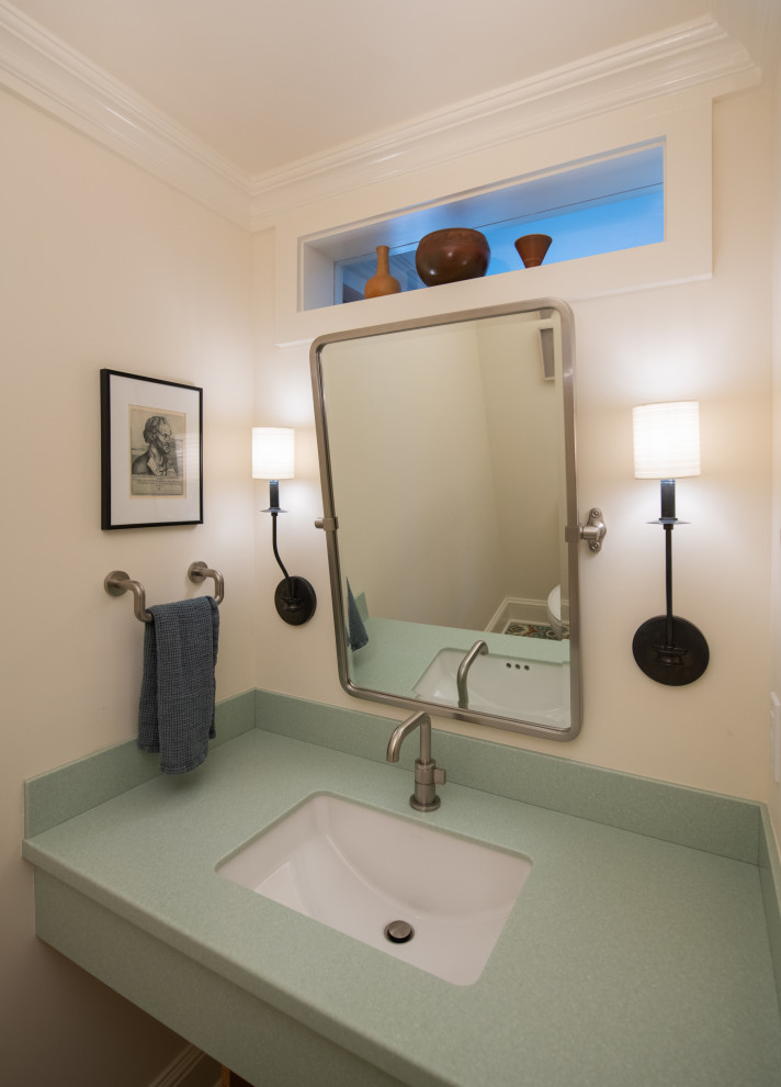 Inspiration for a small eclectic bathroom in Bridgeport with a two-piece toilet, cement tiles, an undermount sink, solid surface benchtops, green benchtops and a single vanity.