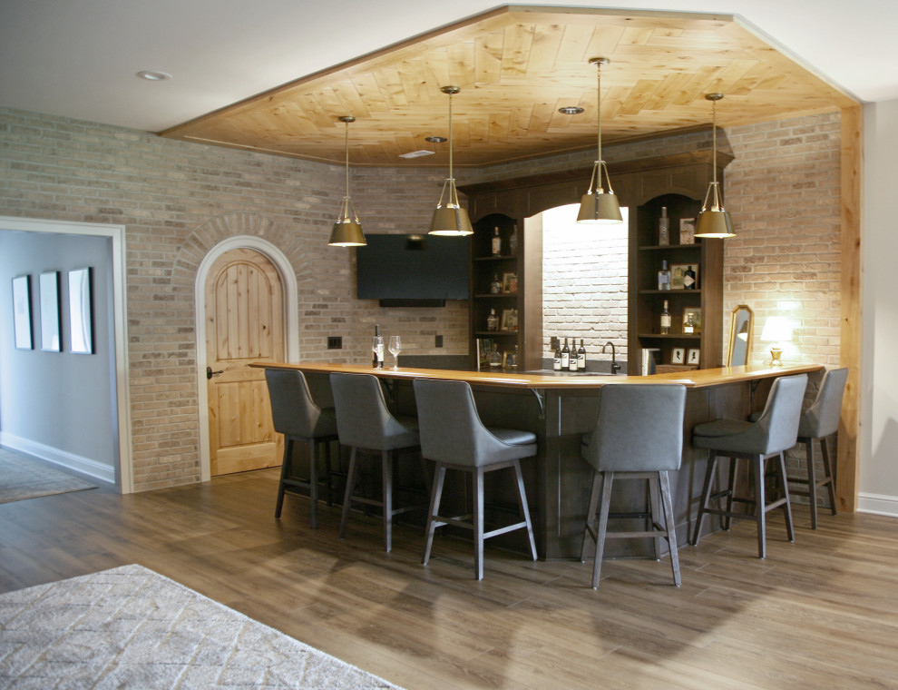 Mid-sized danish u-shaped seated home bar photo in Milwaukee with a drop-in sink, beaded inset cabinets, dark wood cabinets, wood countertops, beige backsplash, brick backsplash and brown countertops
