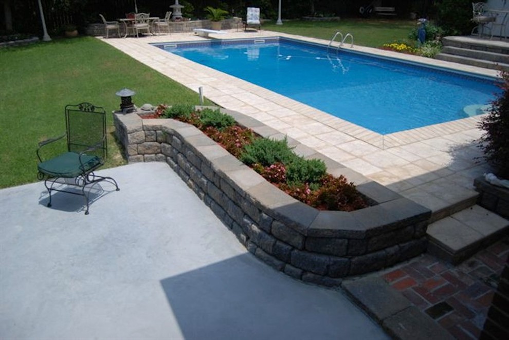 Mid-sized backyard stone and rectangular natural pool fountain photo