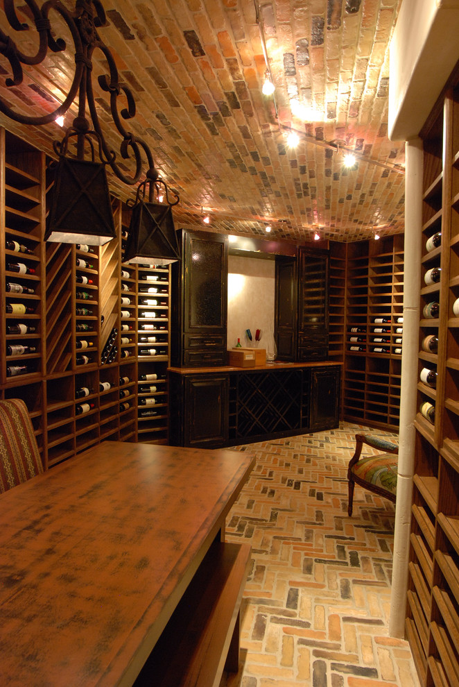 Large mountain style brick floor wine cellar photo in Austin with display racks