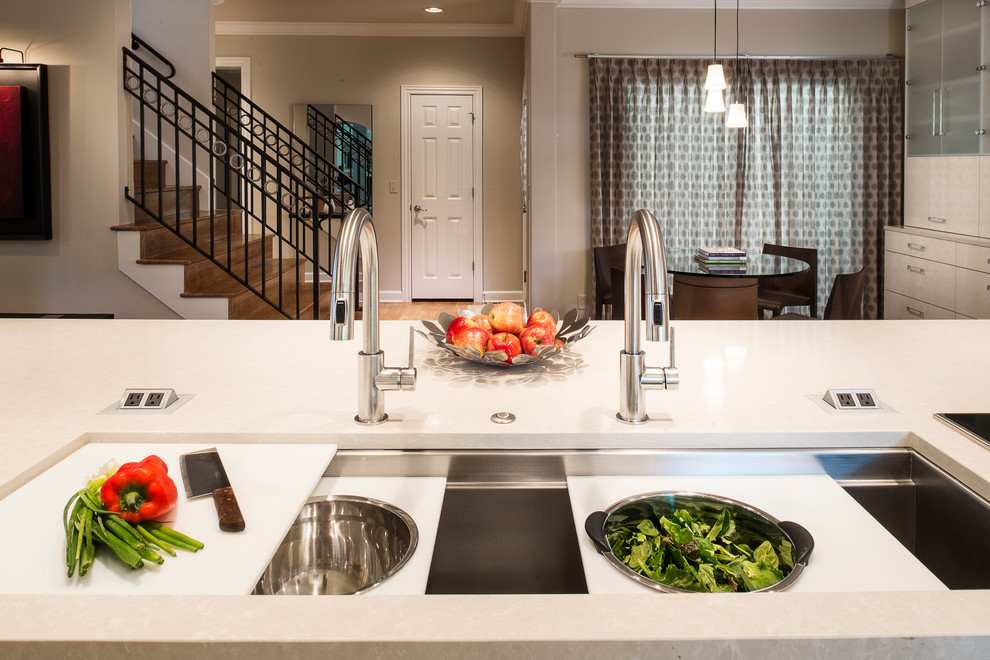 Eat-in kitchen - large contemporary light wood floor and brown floor eat-in kitchen idea in Denver with an undermount sink, flat-panel cabinets, white cabinets, white backsplash, stainless steel appliances and an island
