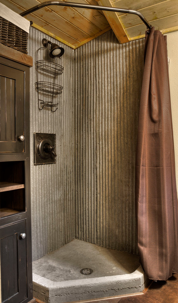 This is an example of a country bathroom in Minneapolis with a corner shower, metal tile and a shower curtain.