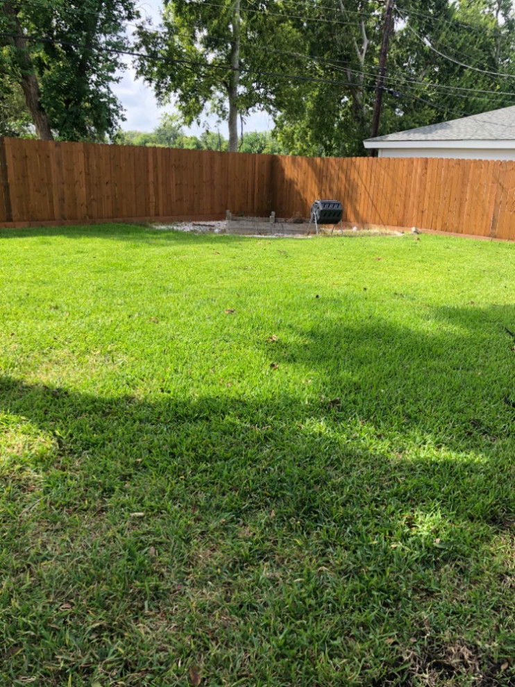 Backyard flagstone walking path with firepit and seating area