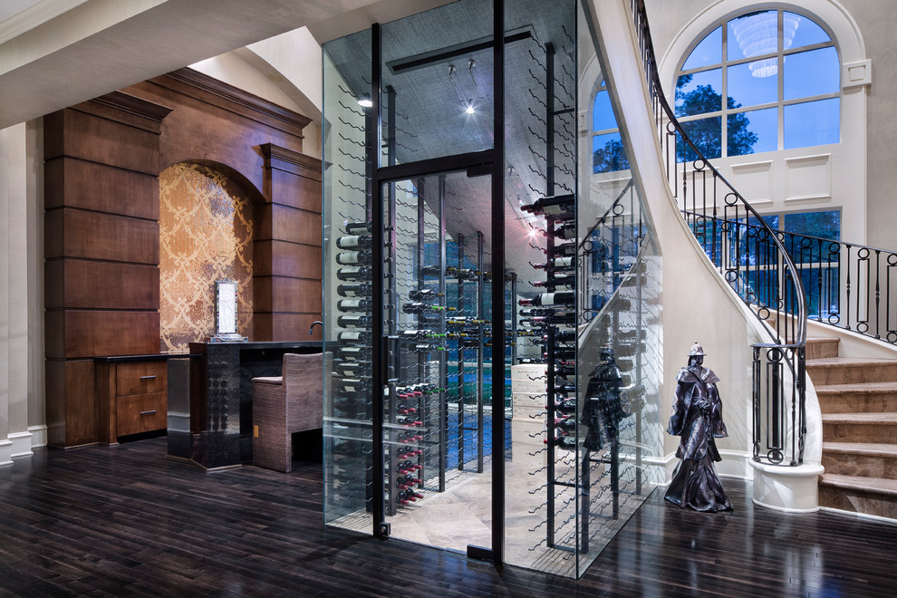 Example of a mid-sized transitional wine cellar design in Houston with storage racks