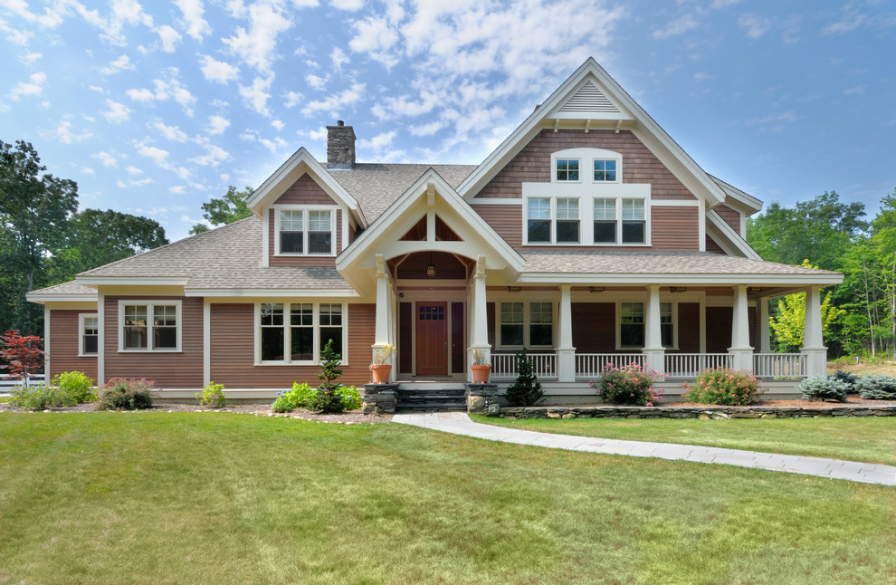 Design ideas for an arts and crafts two-storey beige exterior in Boston with mixed siding.