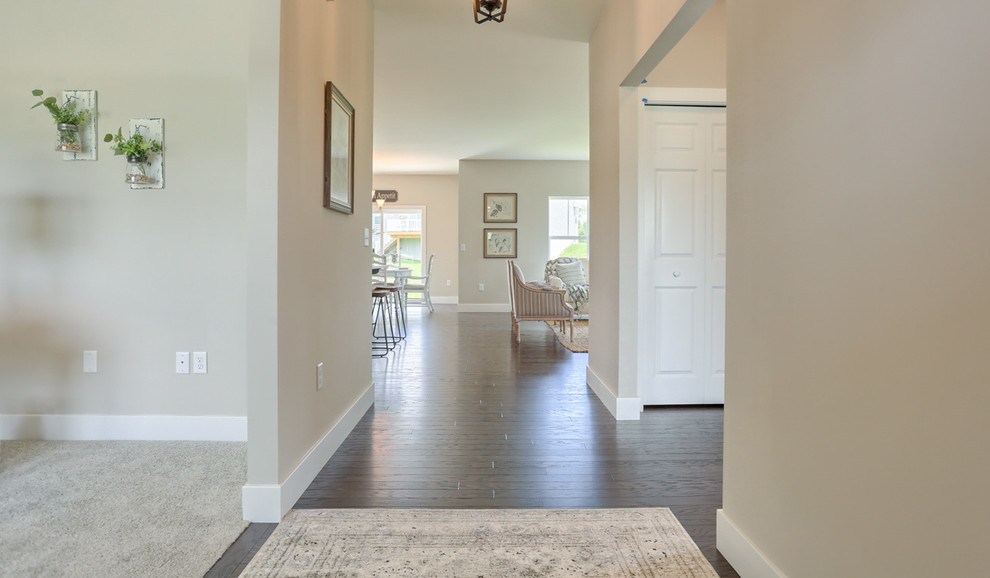 Design ideas for a large traditional foyer in Other with grey walls, medium hardwood floors, a single front door and a blue front door.