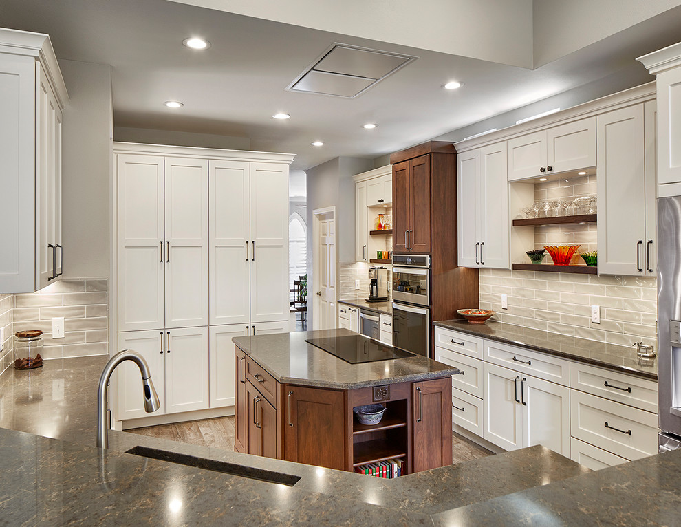 Inspiration for a large transitional ceramic tile and gray floor kitchen remodel in Dallas with an undermount sink, flat-panel cabinets, white cabinets, quartz countertops, beige backsplash, ceramic backsplash, stainless steel appliances, an island and multicolored countertops
