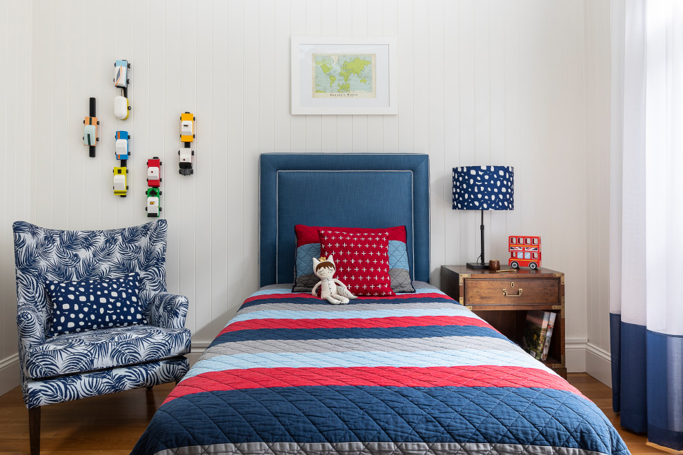 Inspiration for a large transitional kids' bedroom for kids 4-10 years old and boys in Brisbane with white walls, light hardwood floors, brown floor and planked wall panelling.