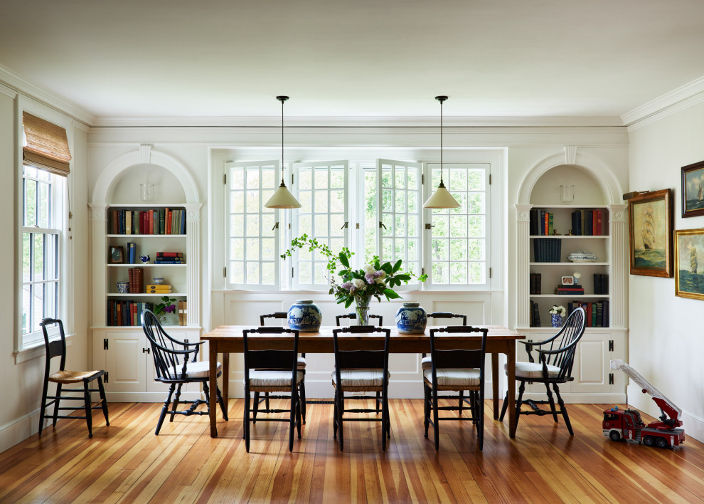 Great room - large coastal medium tone wood floor and brown floor great room idea in Manchester with white walls