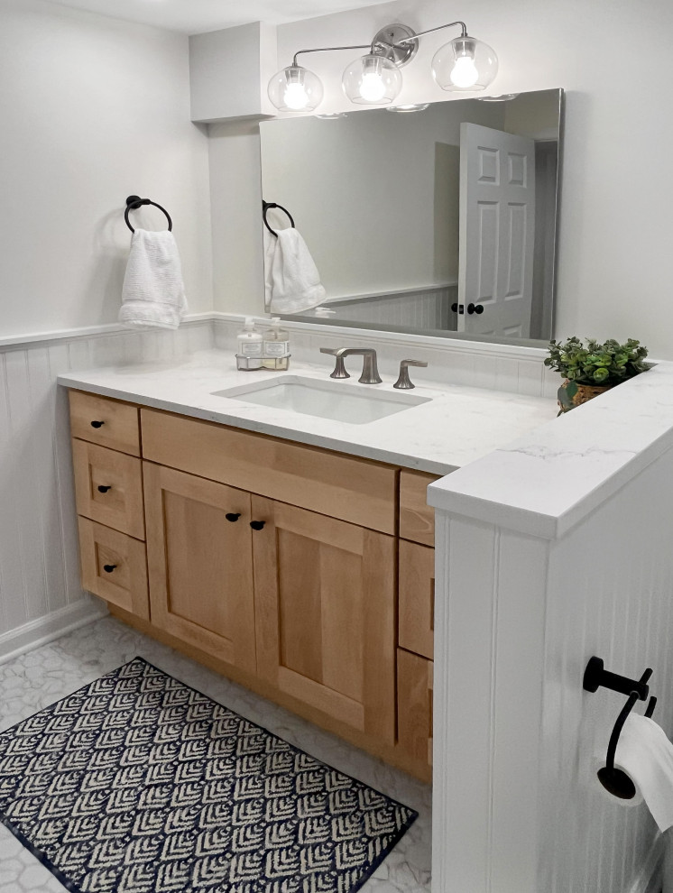 Design ideas for a medium sized classic bathroom in Philadelphia with light wood cabinets, white tiles, porcelain tiles, engineered stone worktops, a hinged door, white worktops, a single sink and a built in vanity unit.