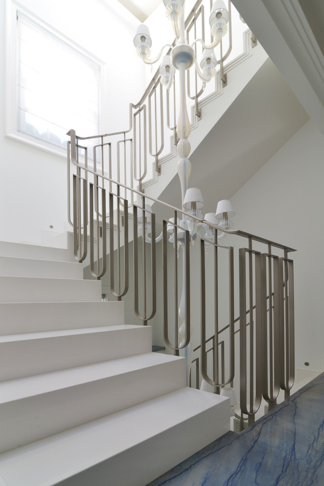 Inspiration for a large contemporary metal floating staircase in London with metal risers.